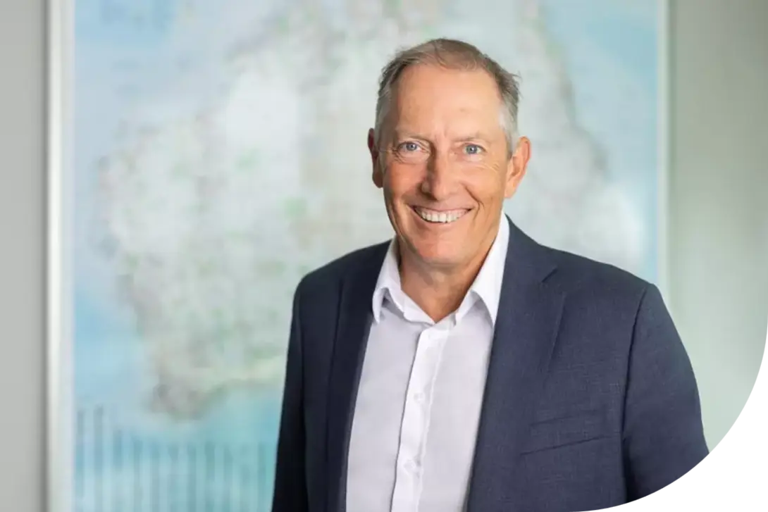 Phil, CEO of Heidelberg Materials Australia, standing in front of a map backdrop