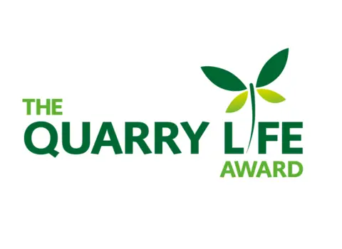 Quarry Life Award logo with green text and leaf design symbolising sustainability and nature