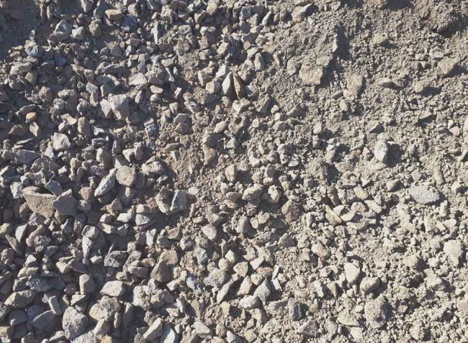 Close-up of bulk fill material with a mix of fine soil and small aggregates, used for backfilling, levelling and general construction earthworks.