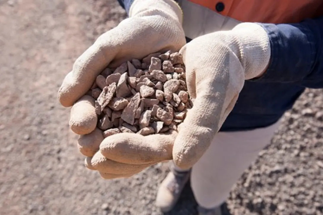 Compacted road base material with a mix of crushed rock and fines, used to create a stable foundation for roads, driveways and pavements.
