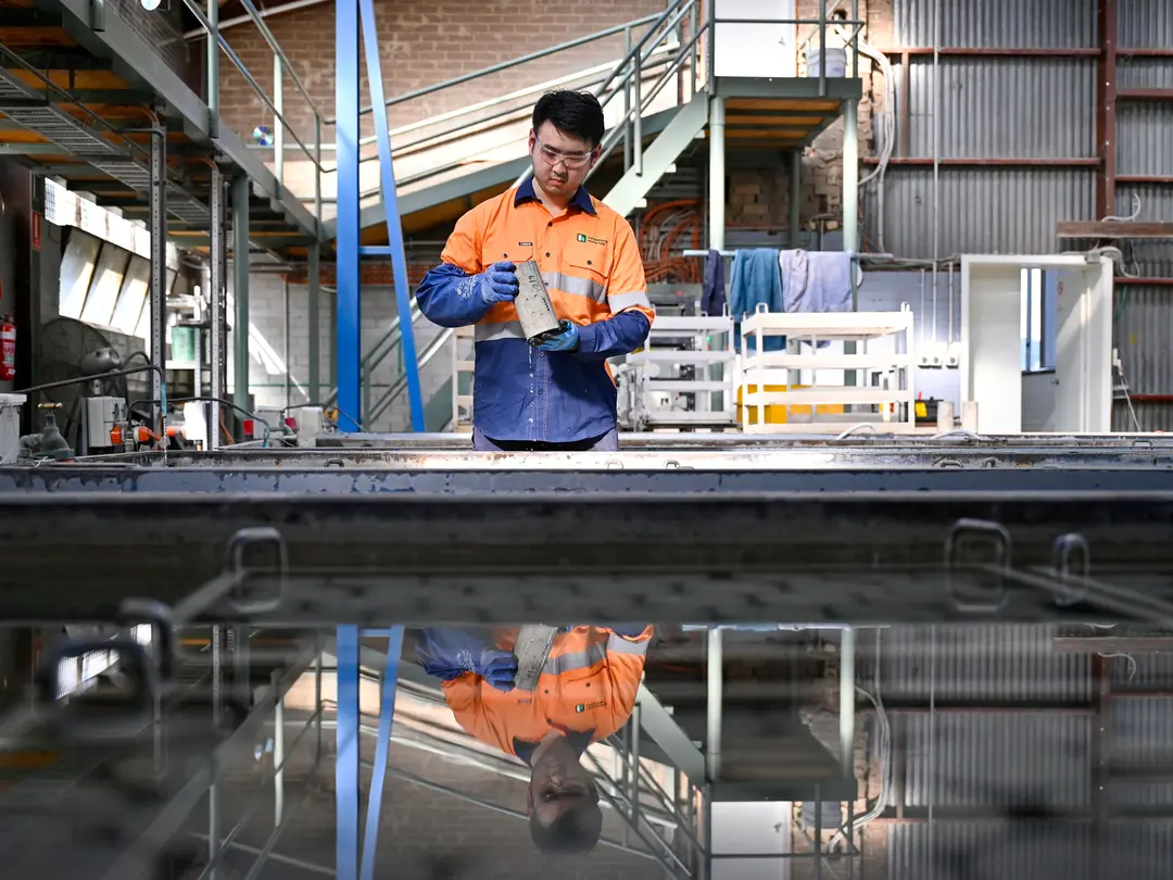 Heidelberg Materials laboratory technician preparing and testing material samples in a quality control laboratory to ensure product performance and compliance.